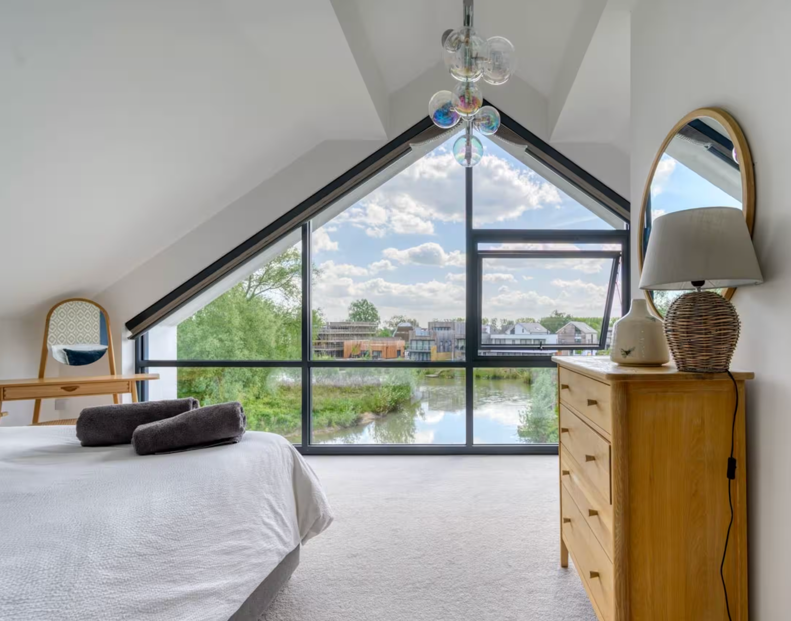 Bedroom with a large triangular window